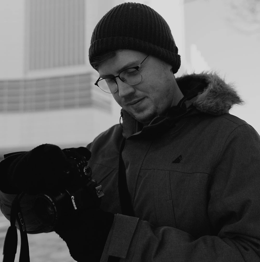Photographer looking at the photo he just took.